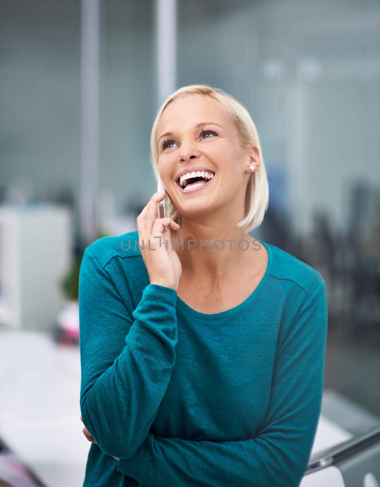 Woman, phone call and laugh with thinking in office for networking, contact or negotiation. Business person, smartphone and excited for conversation, communication and mobile connection in workplace.