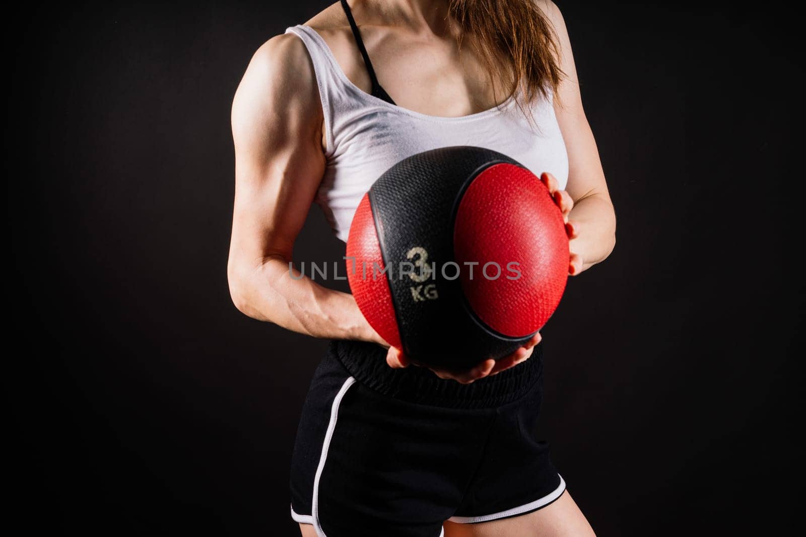 Strong woman does exercise with med ball slams. Strength and motivation. by Zelenin
