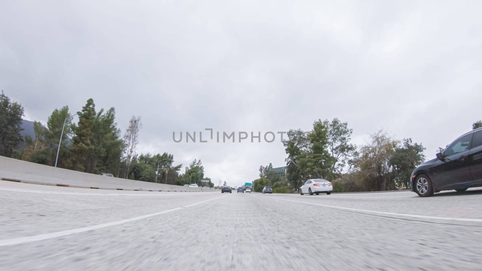 Los Angeles, California, USA-December 4, 2022-POV-Amidst a rainy winter day, driving on HWY 134 near Los Angeles, California, captures the atmosphere through raindrop-covered lenses, adding a unique and moody perspective to the journey.
