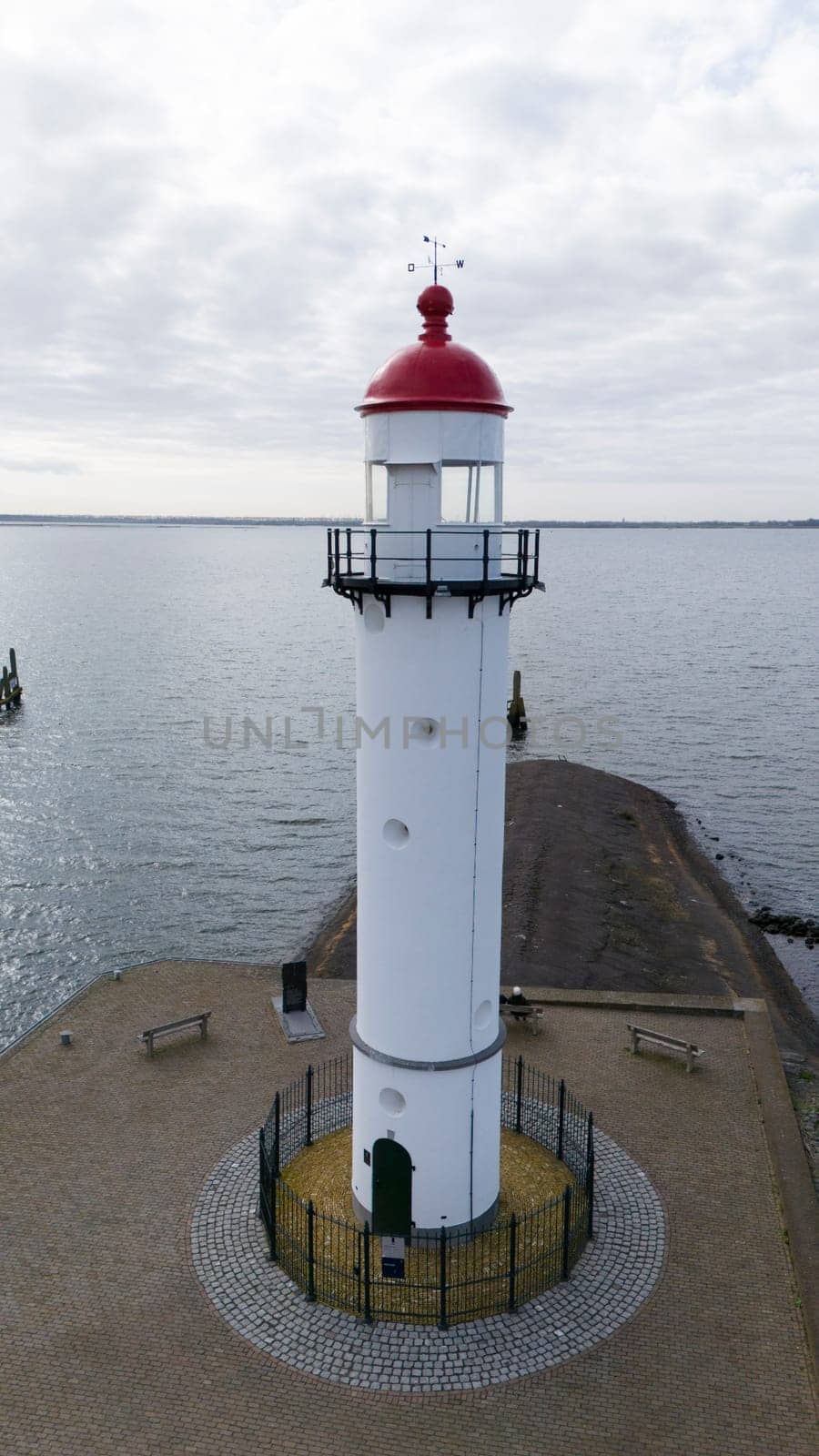 The lighthouse in Hellevoetsluisin the netherlands made with a drone aerial view