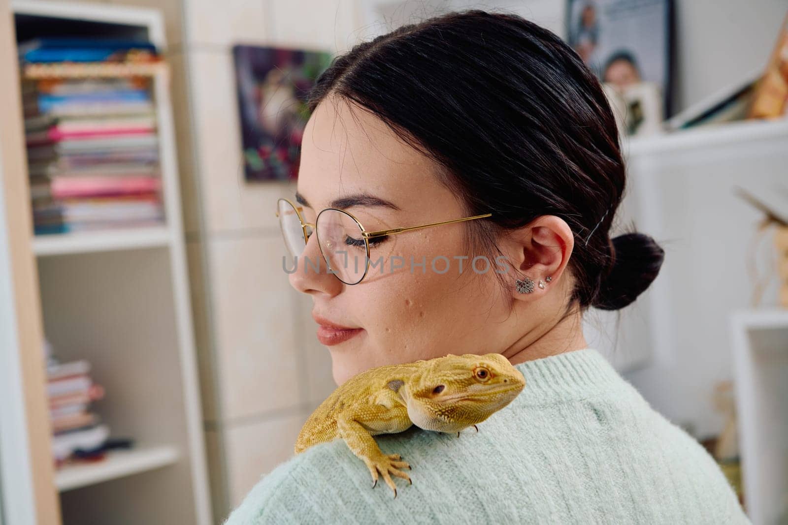 A beautiful woman in a joyful moment, posing with her adorable bearded dragon pets, radiating love and companionship.