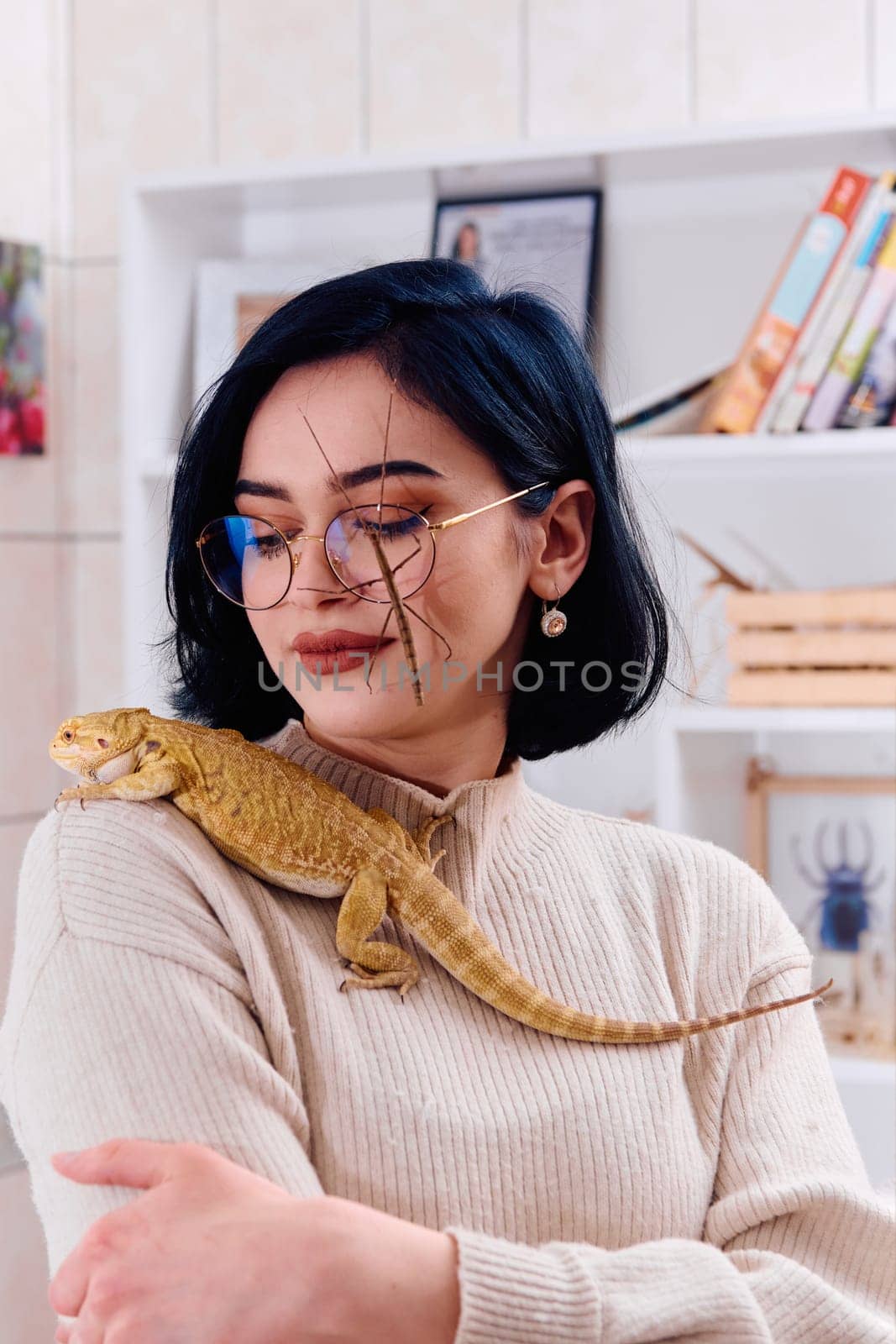 Woamn and Her Pets: A Bearded Dragon and a Stick Insect by dotshock