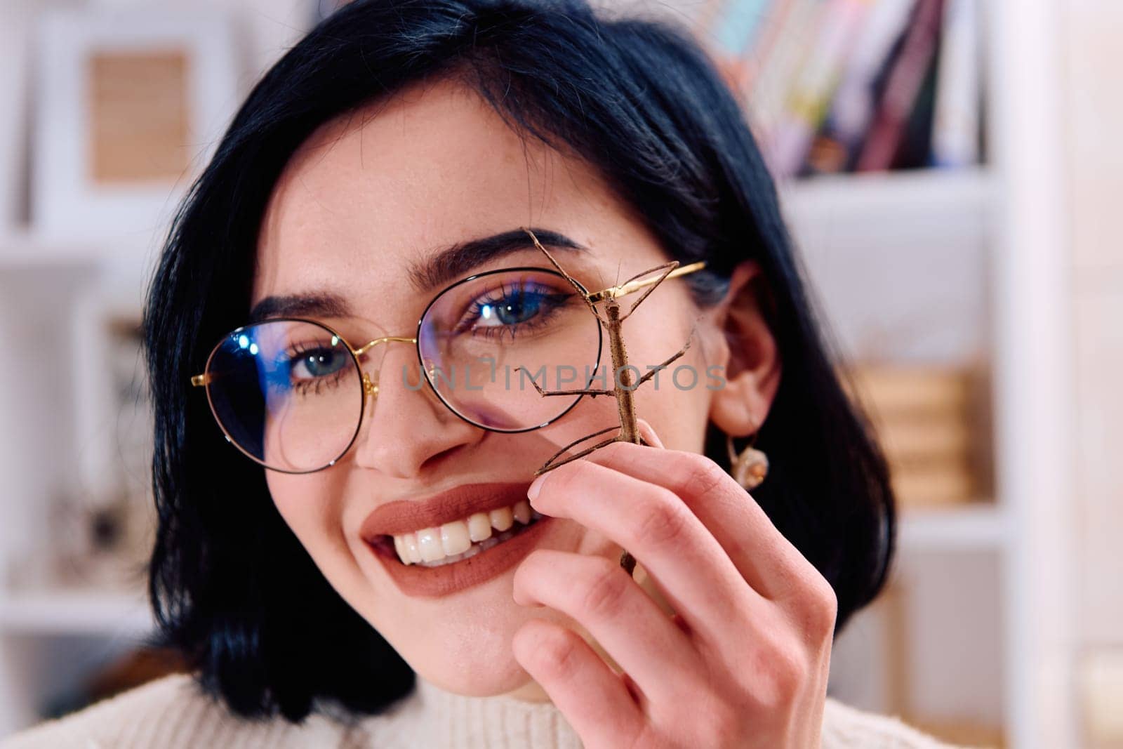 Young Woman Captured in a Beautiful Moment with Her Stick Insect (Medauroidea Extradentata) by dotshock