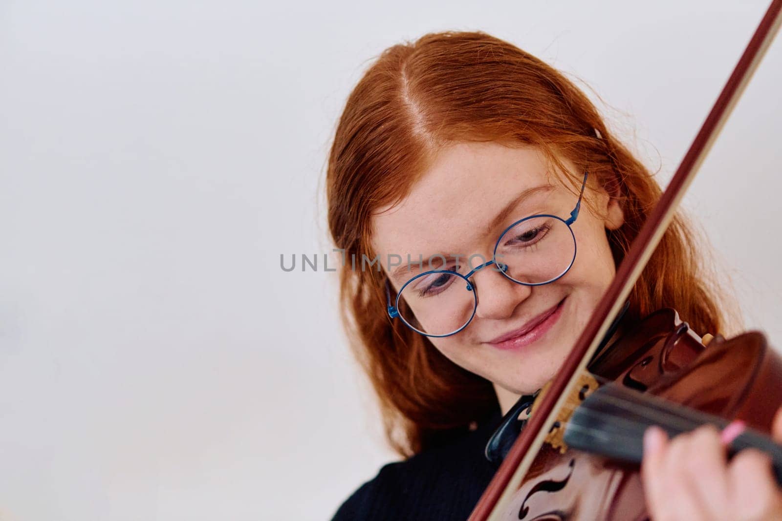 Stunning Redhead Musician Poses with Violin in Captivating Portrait by dotshock