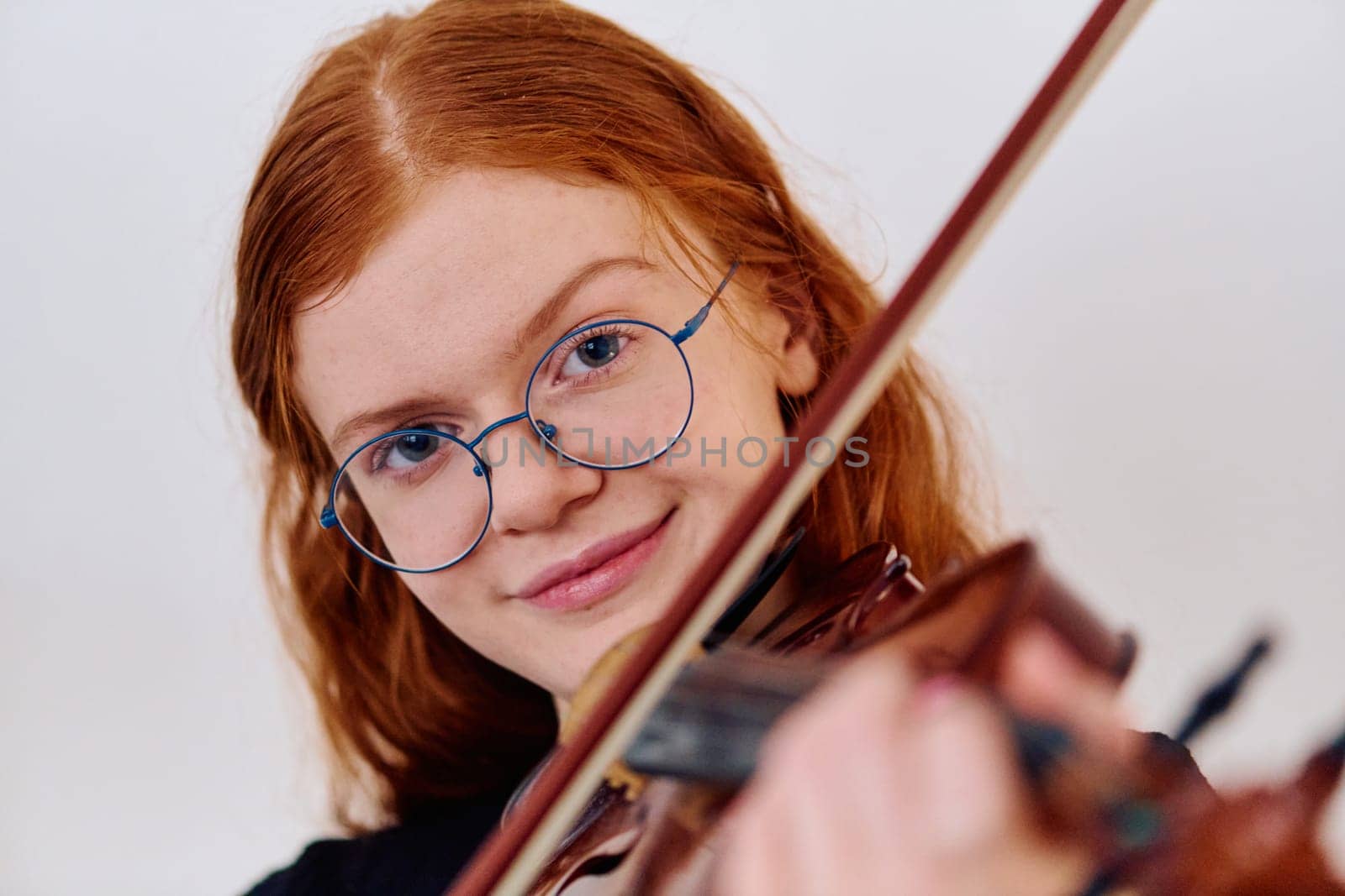 Stunning Redhead Musician Poses with Violin in Captivating Portrait by dotshock
