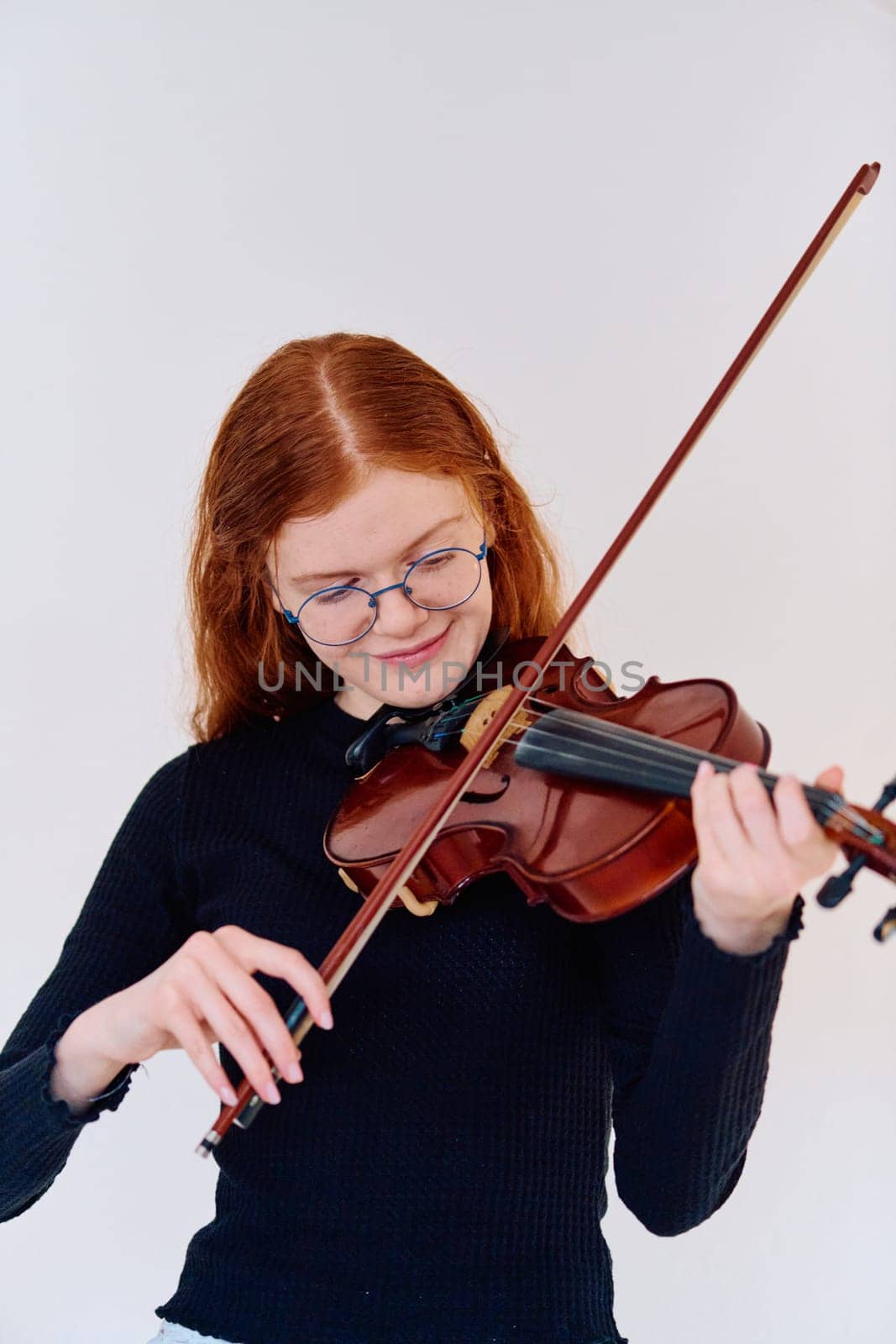 Stunning Redhead Musician Poses with Violin in Captivating Portrait by dotshock