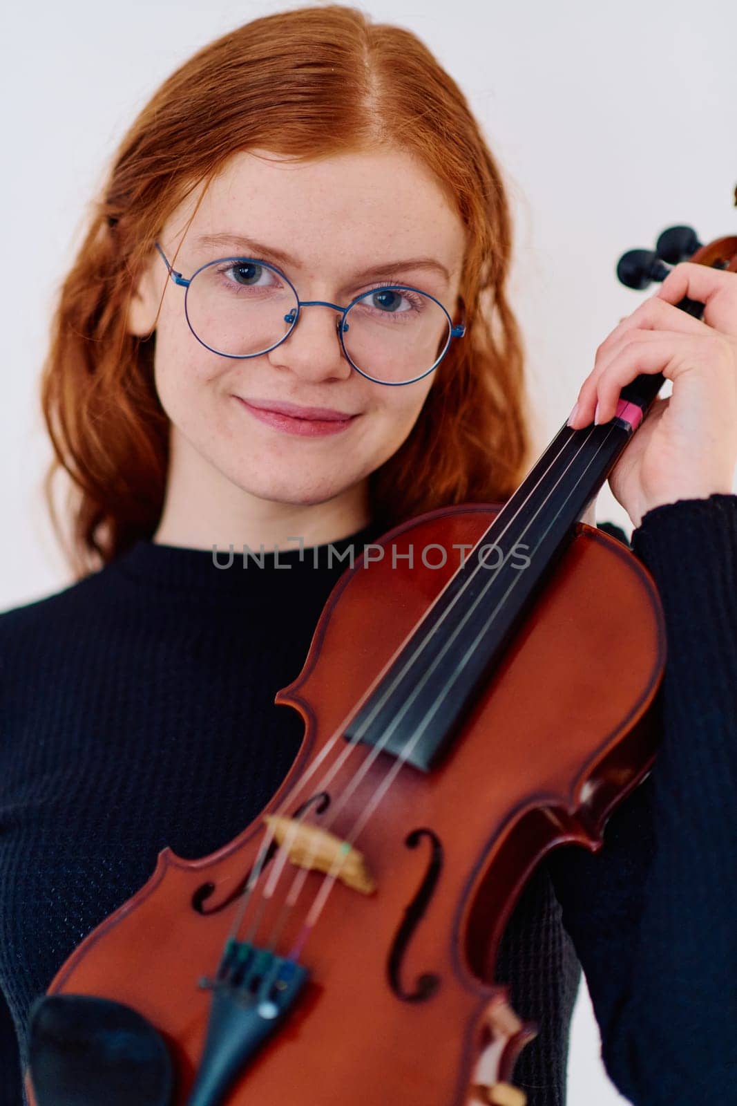 Stunning Redhead Musician Poses with Violin in Captivating Portrait by dotshock