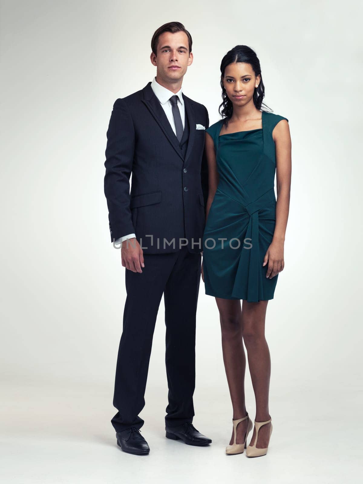Portrait, event and couple in vintage fashion in studio and confidence in elegant style in mockup. Face, pride or young man by woman in retro clothes, diversity or class for party by white background by YuriArcurs