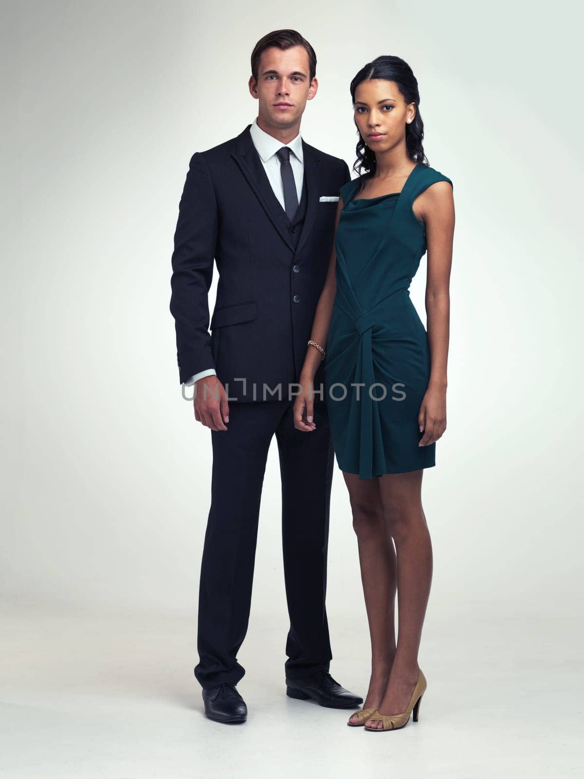 Portrait, retro or couple in formal fashion in studio or confidence in vintage style in mock up. Face, confident or young man by woman in elegant clothes, love or classy for party by white background by YuriArcurs