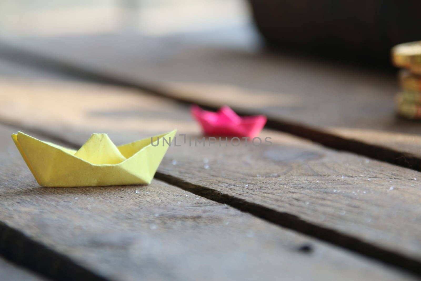 Summer time concept. Origami paper boats. by Markgraf