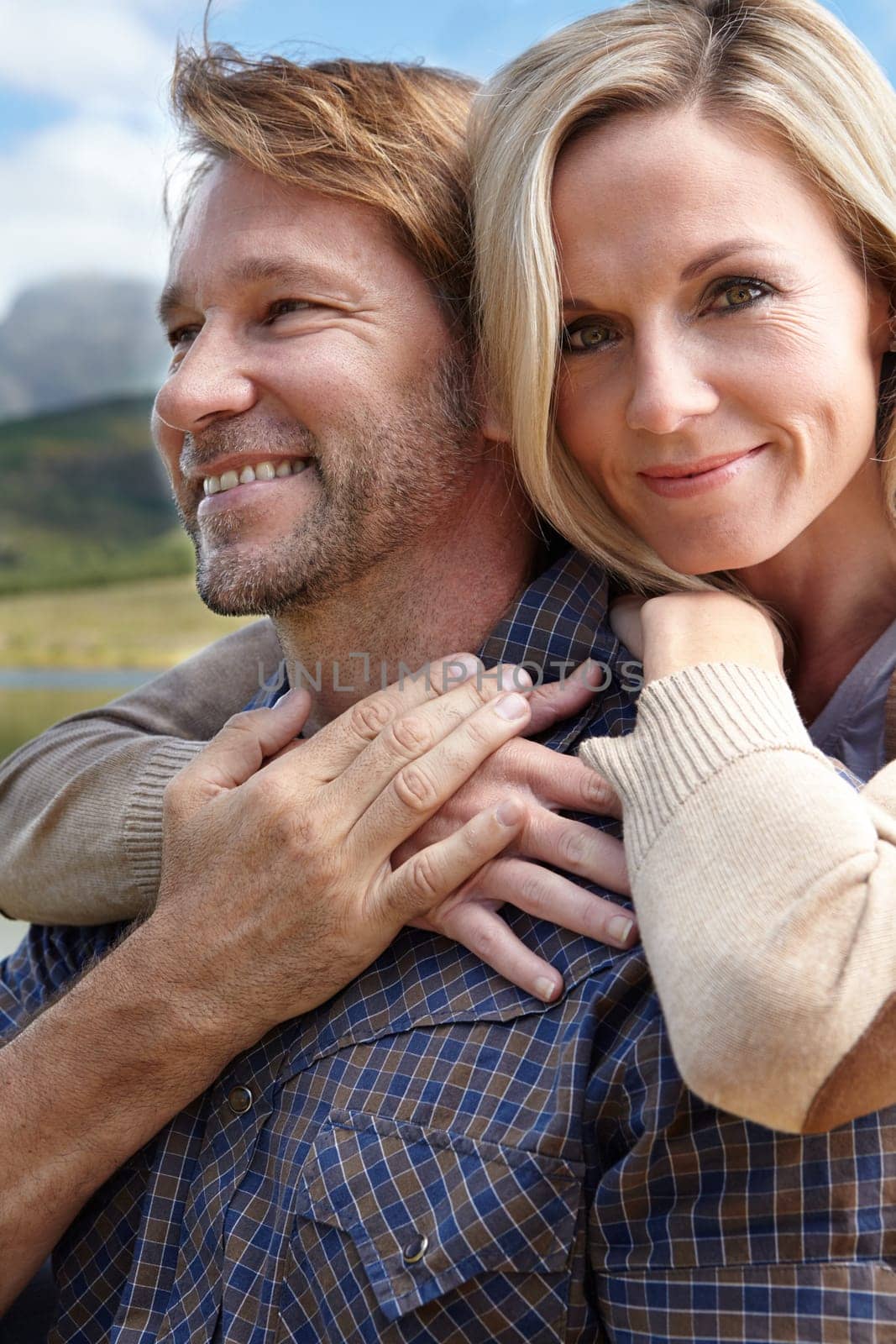 Happy, love and portrait of couple at countryside in spring for bonding, adventure and holiday together. Man, woman and smile in nature for weekend vacation, travel and tourism outdoors in Europe.