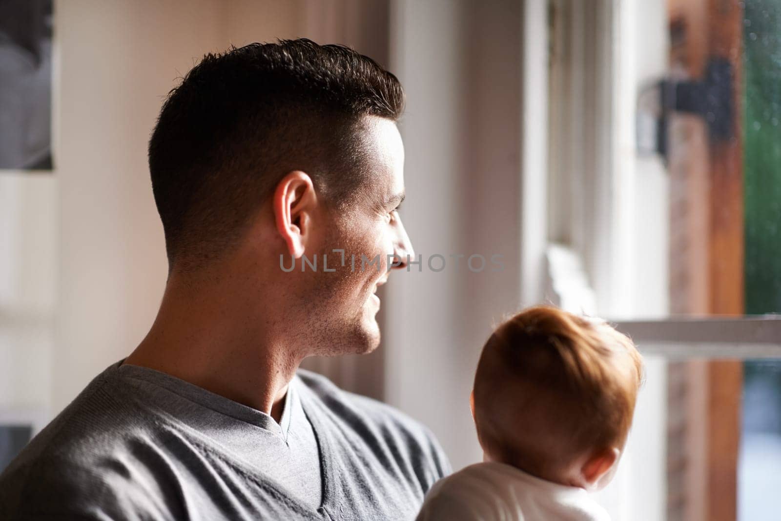 Home, father and baby with smile and happy in the morning with bonding, care and family love. Support, trust and young child with dad and calm together in a new house with thinking and idea by window by YuriArcurs