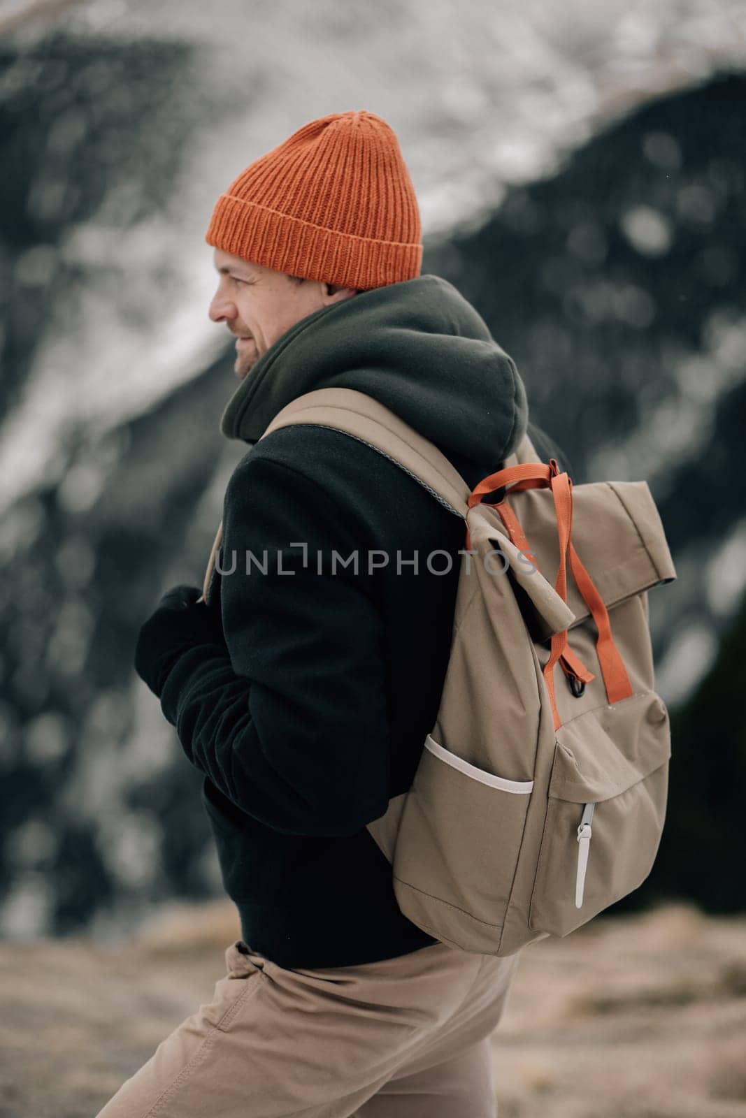 Smiling Hiker Enjoying a Snowy Mountainous Adventure by apavlin