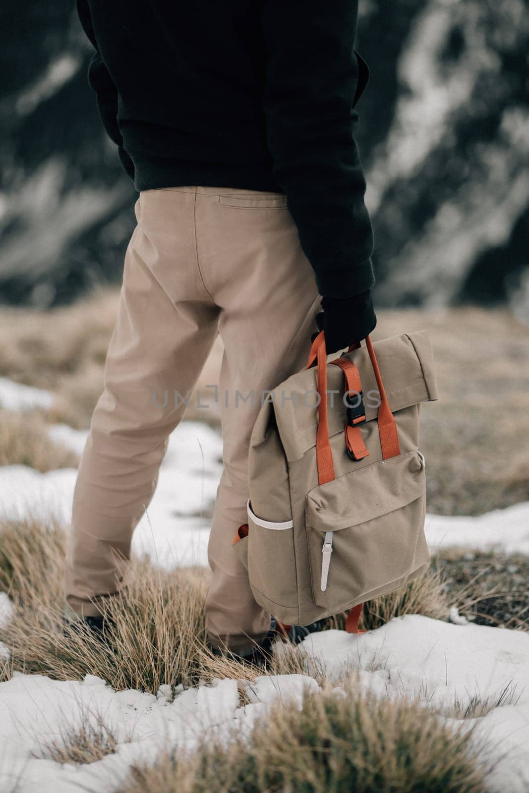 Back View of a Hiker with a Backpack on a Snowy Trail by apavlin