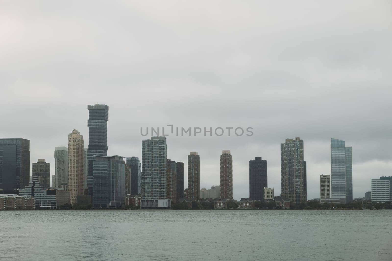 Cloudy Skyline View of New York City's Waterfront Architecture by apavlin