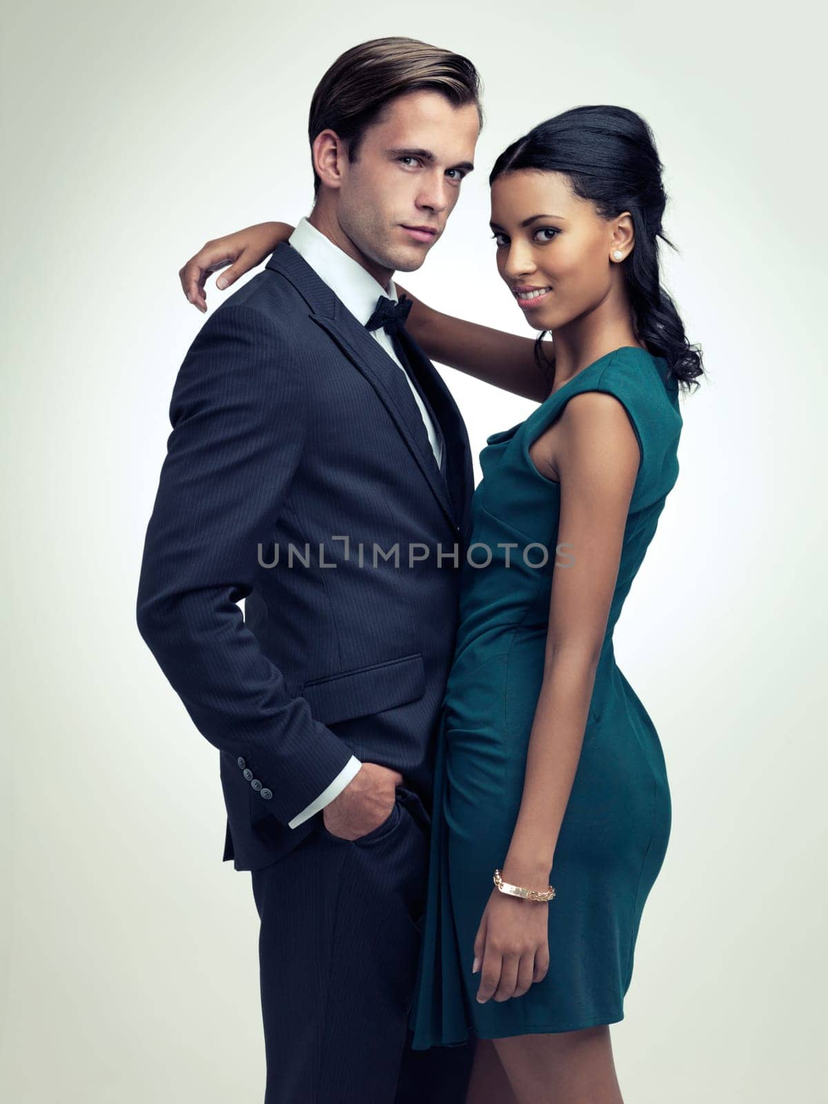 Couple, studio and portrait with retro, vintage and fashion for rich luxury romance. Man, woman and model with tuxedo, glamour and confidence for classy black tie event isolated on white background.