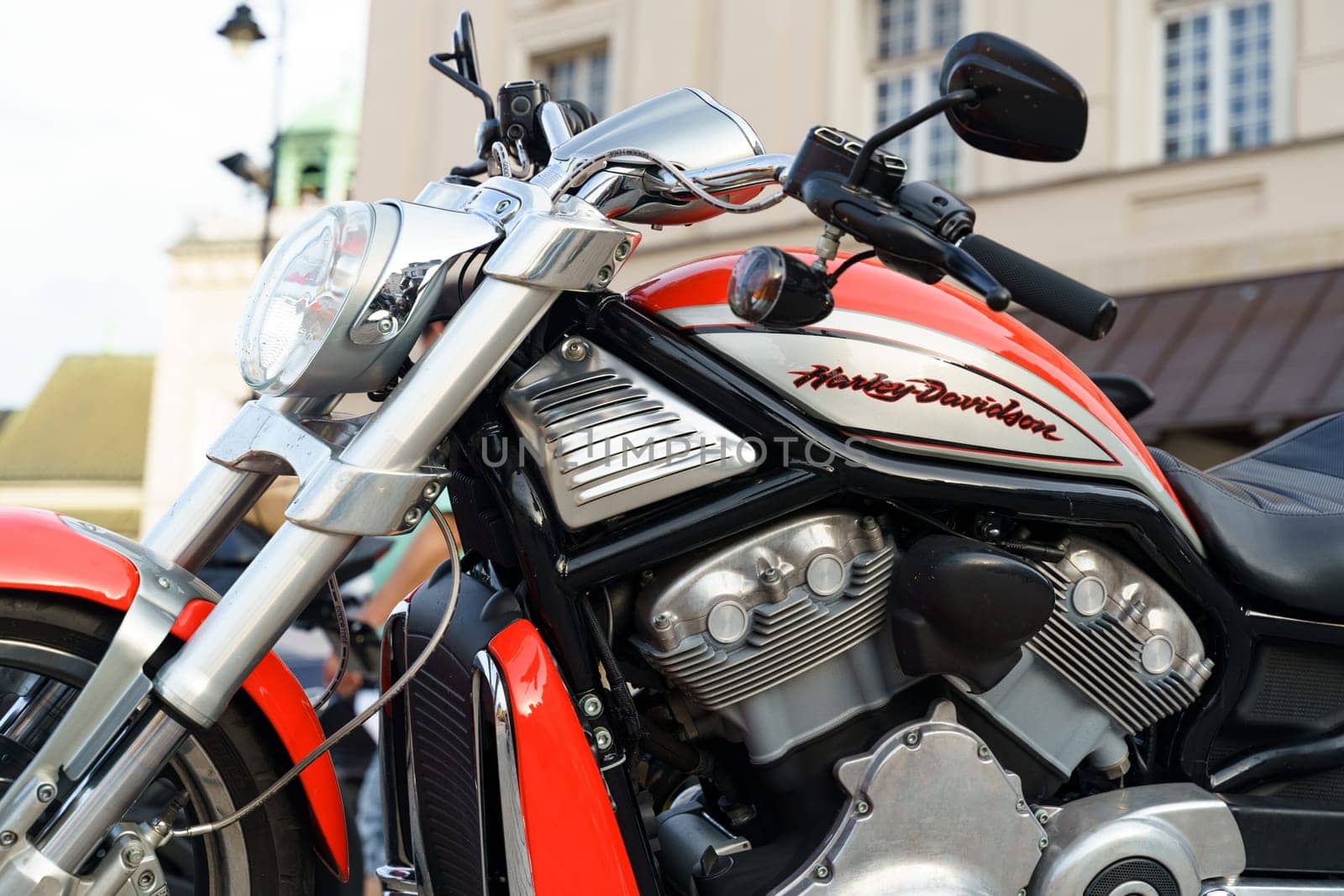 Warsaw, Poland - August 6, 2023: A Harley Davidson motorcycle is parked in a parking lot, side view. Close-up