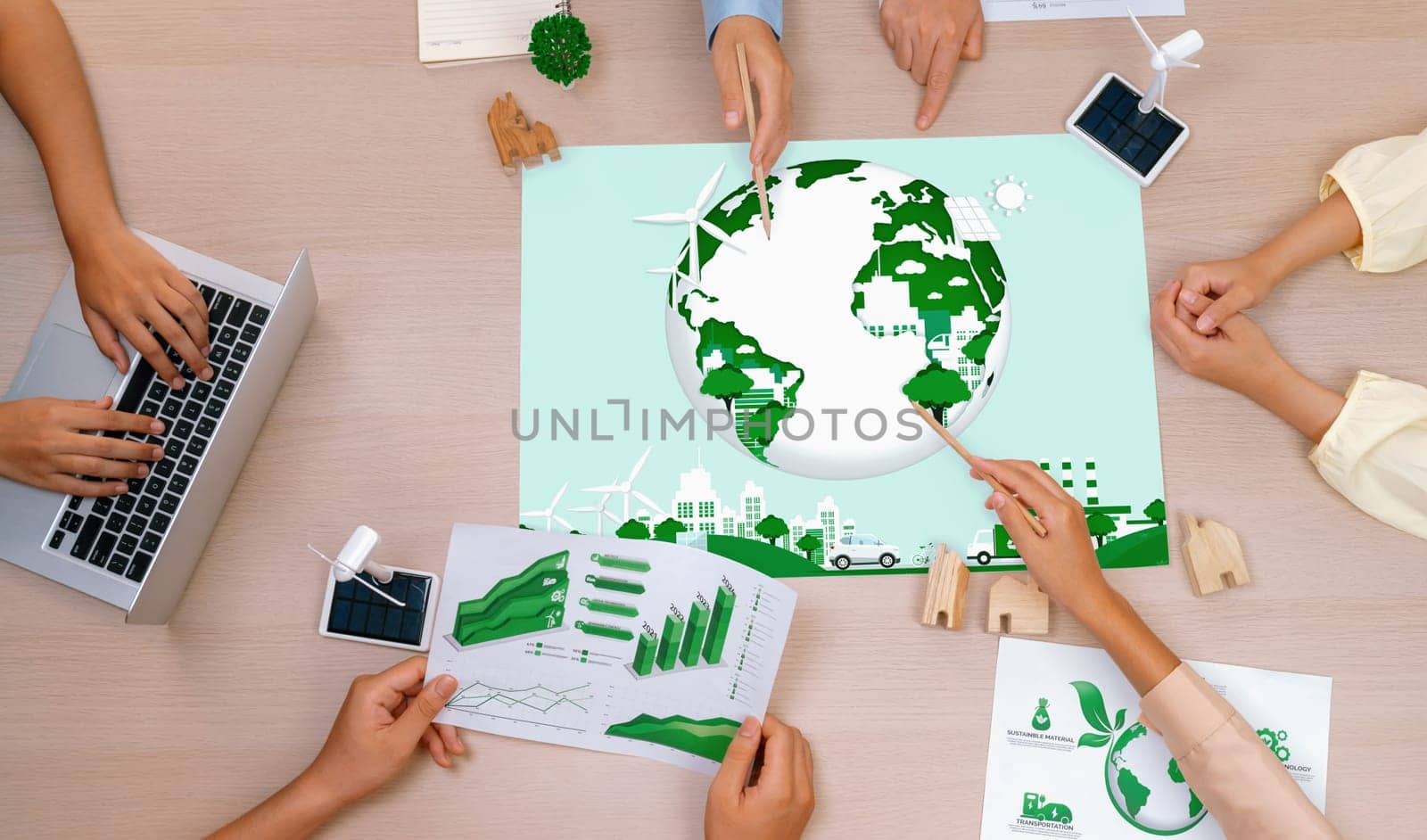 Green city illustration placed on green business meeting table. Delineation. by biancoblue