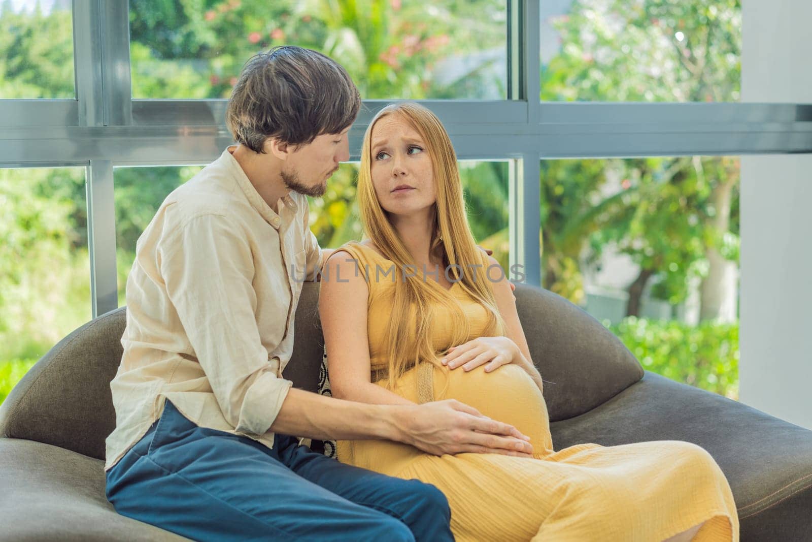 Expectant woman feels unwell, husband comforts and reassures her during a challenging pregnancy.