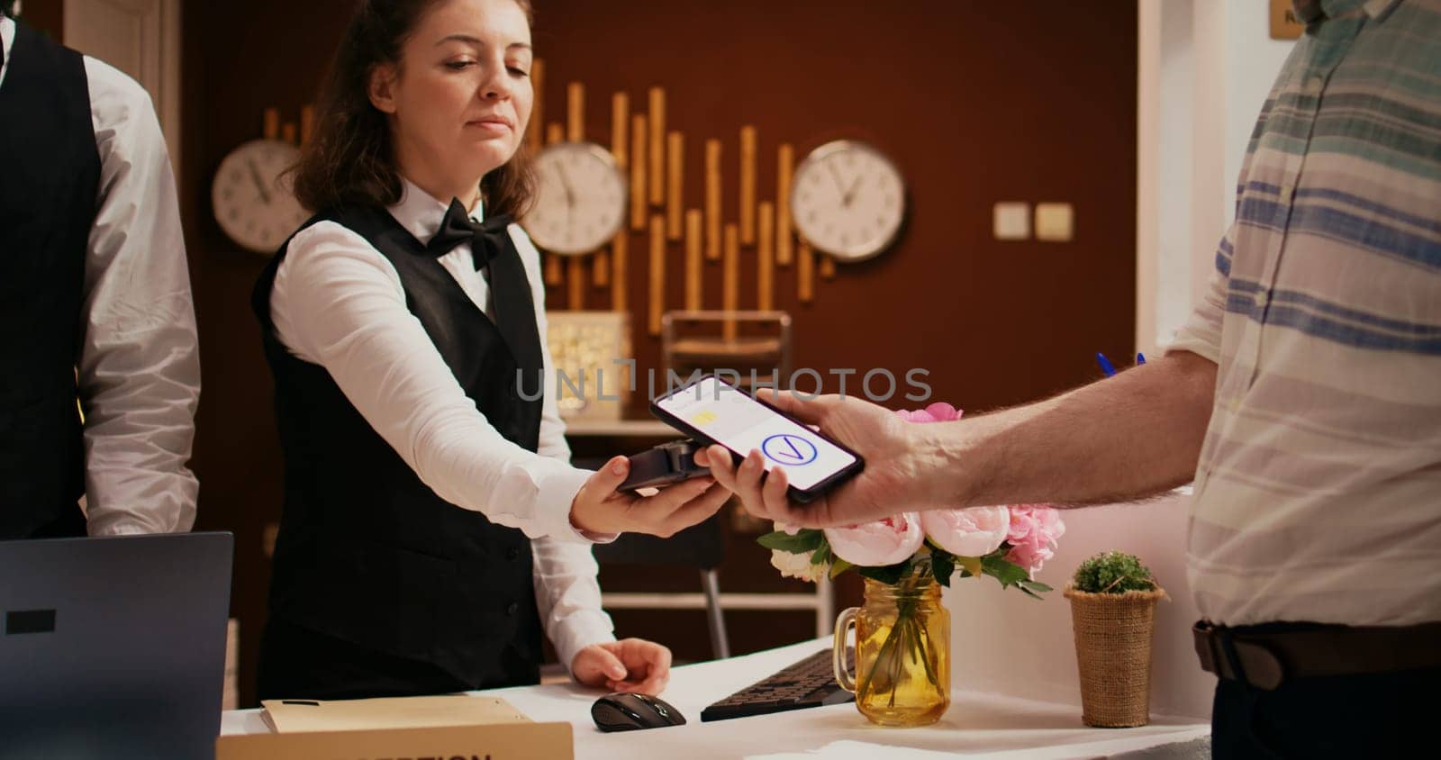 Retired guest using mobile payment by DCStudio