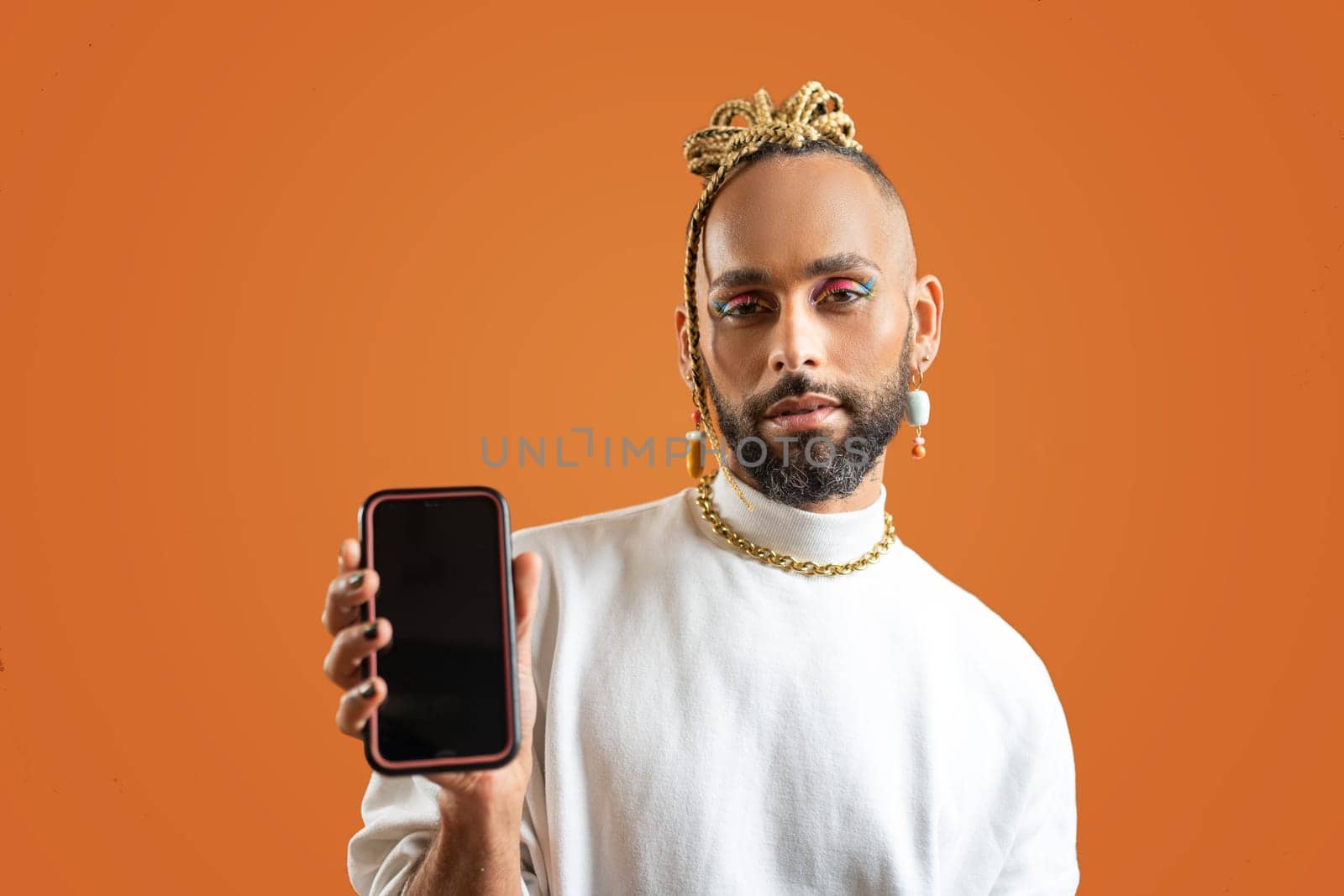 Black Gay Man with bright makeup use smartphone by andreonegin