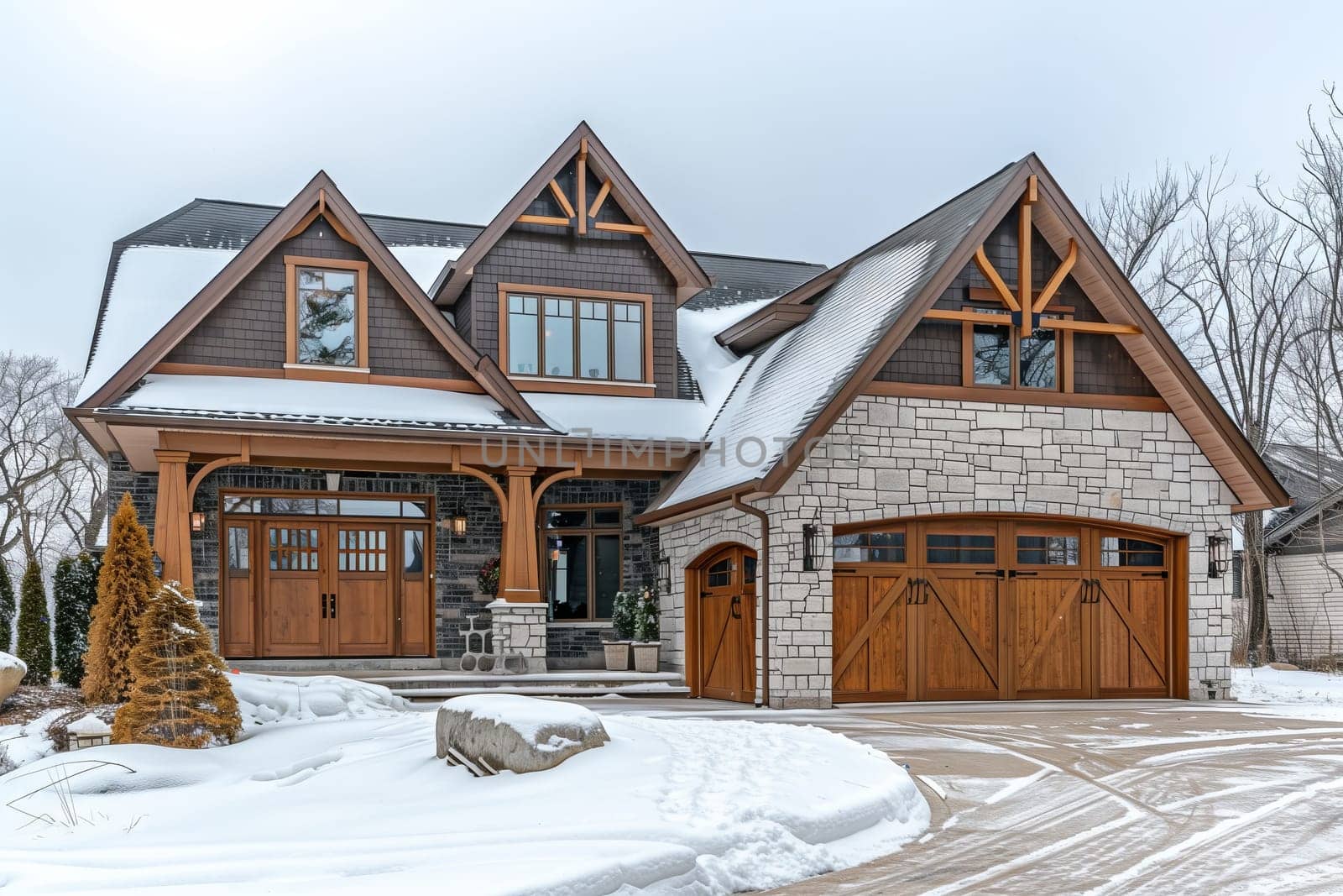 A building with wooden siding and a garage door is blanketed in snow under a wintry sky, resembling a cozy cottage in a real estate setting