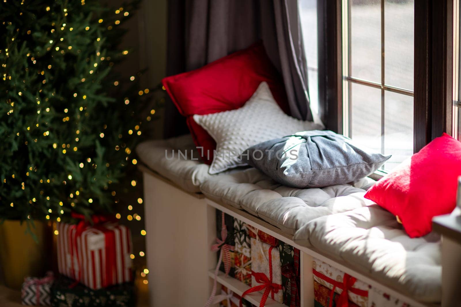 Window sill with New Year's elements - Christmas trees, decorations, Christmas balls. Merry Christmas and Happy New Year greeting card. Cozy background.