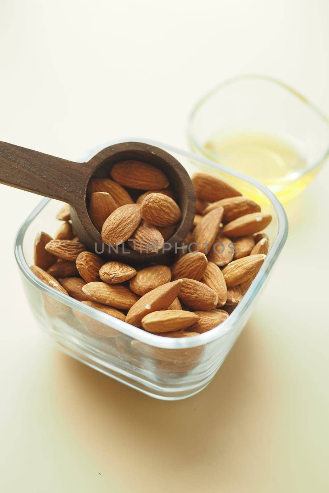 Close up of almond nut isolated on white .