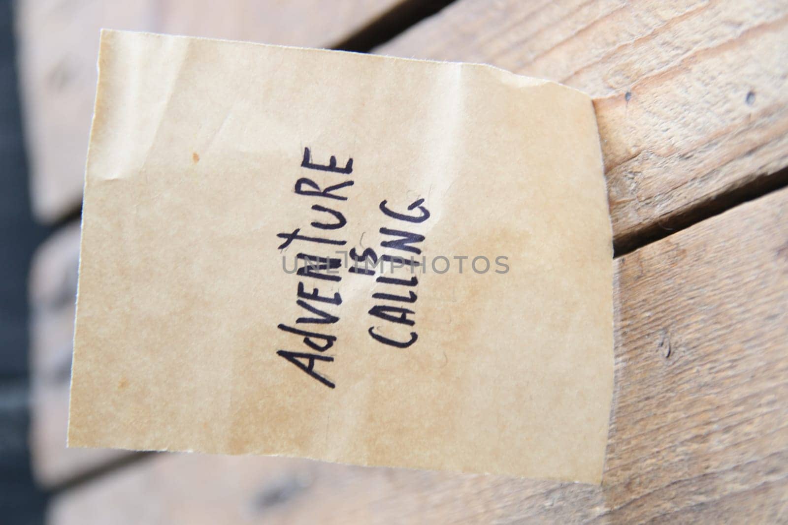 Adventure is calling card. The inscription on the tag. Vintage style. Motivational quotes.