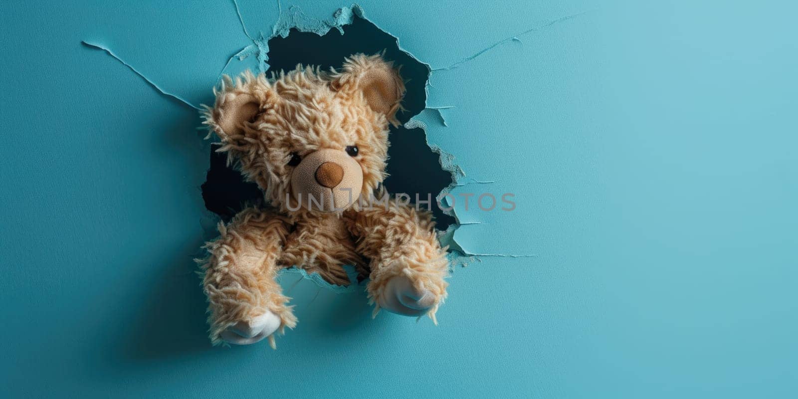 Close up view picture of the hollow blue hole on the the wall that show the teddy stay inside the wall that has been made from some material yet still can be break to look through other side. AIGX03.
