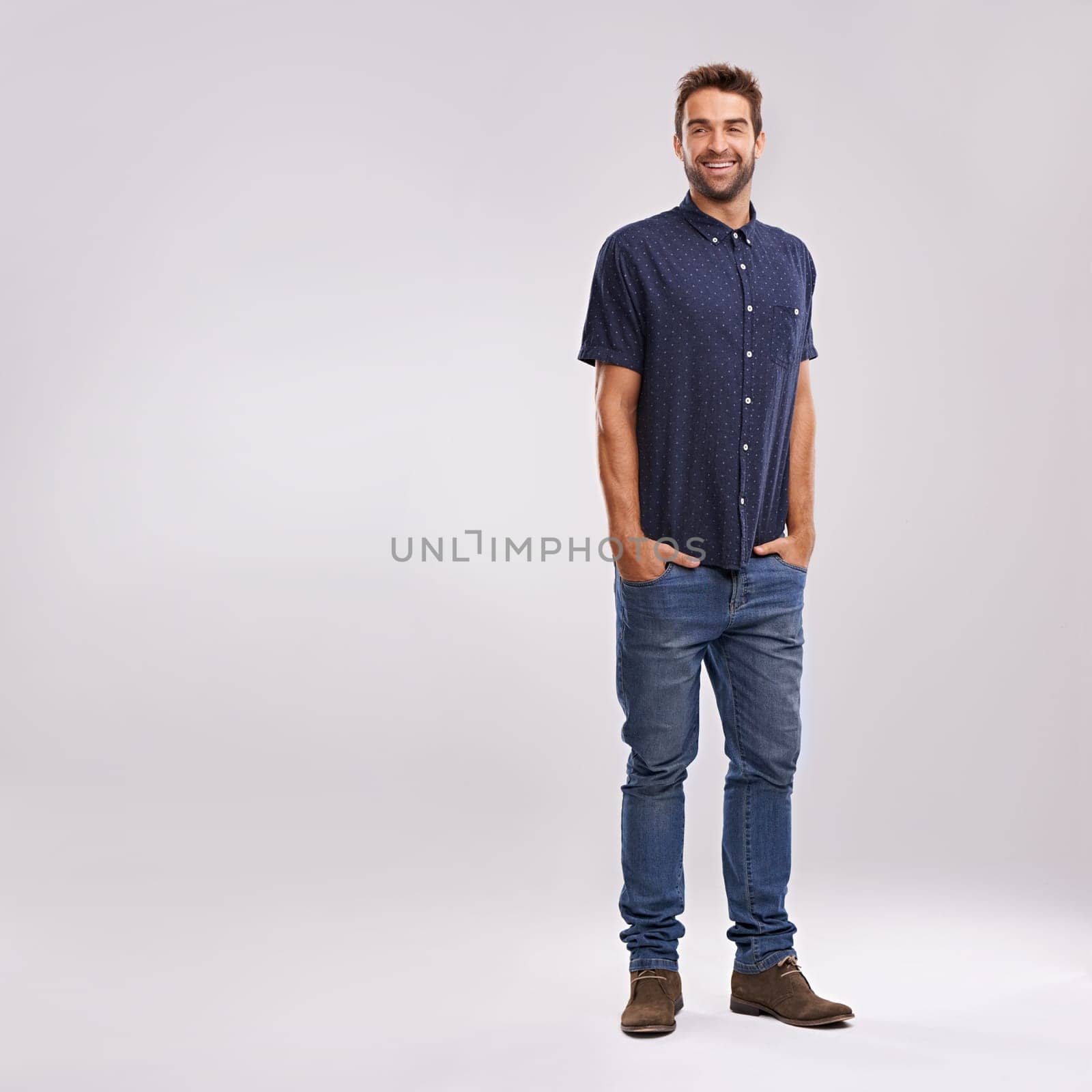 Creative, businessman and portrait of fashion in studio, background and mockup with confidence. Happy, man and relax in jeans with pride or casual style in business as art director or entrepreneur.