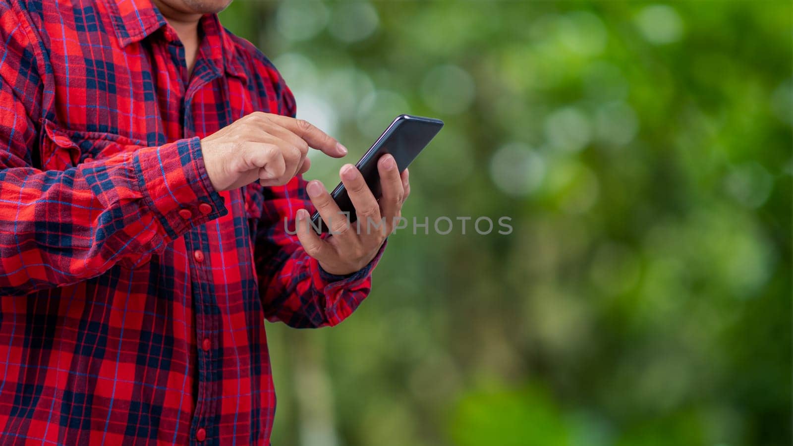 Smart farming with IoT, Growing plant seedlings infographic, Smart farming and precision agriculture 4.0, Farmer hand holding smartphone on green background. by Unimages2527