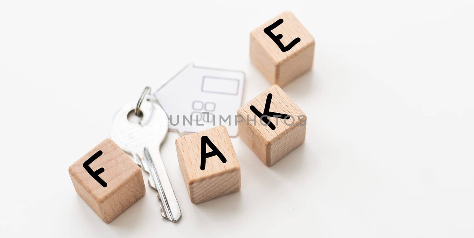 the word fake on wood cubes, banknotes and calculator on the background, business and finance concept. High quality photo