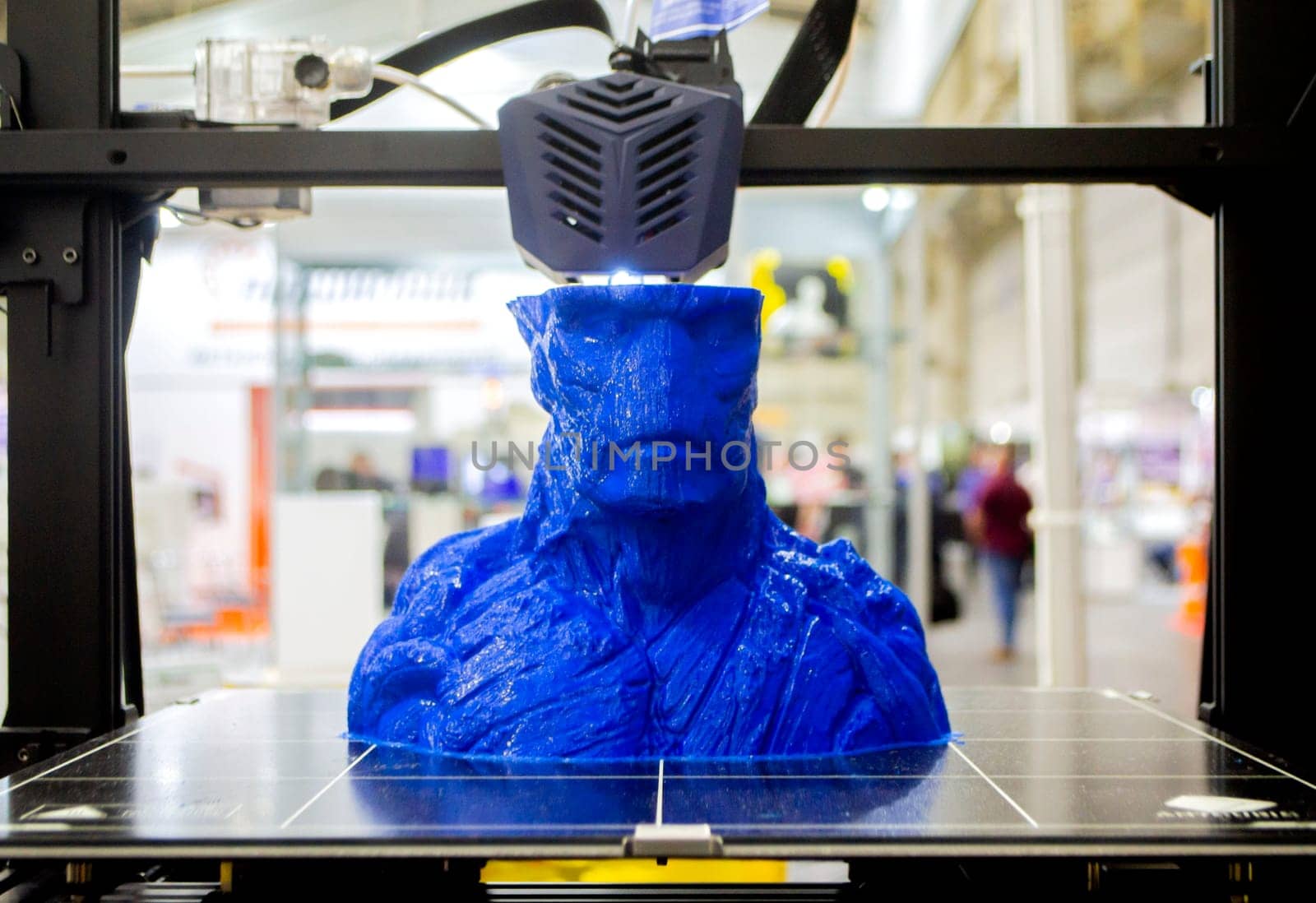 3D printer prints an object. The process of printing model on 3D printer. Model printed on 3D printer from molten plastic. 3D printing technologies. Additive progressive new modern printing technology