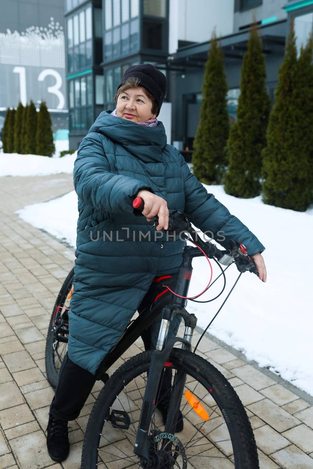 A healthy pensioner woman went for a bike ride in the cold by TRMK