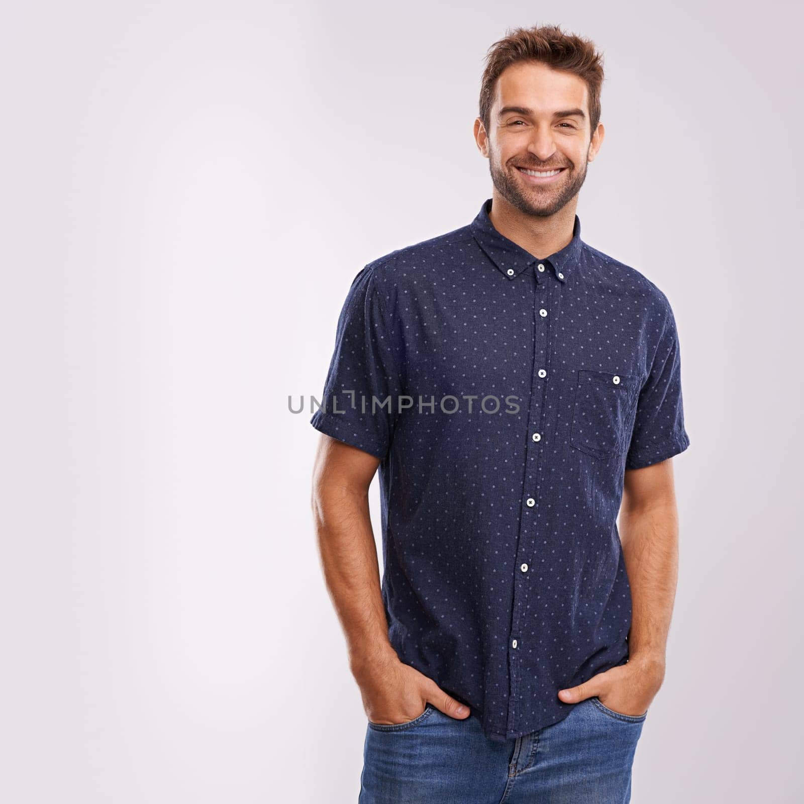 Creative, fashion and portrait of businessman in studio, background and mockup with confidence. Happy, man and relax in jeans with pride or casual person in business as art director or entrepreneur by YuriArcurs