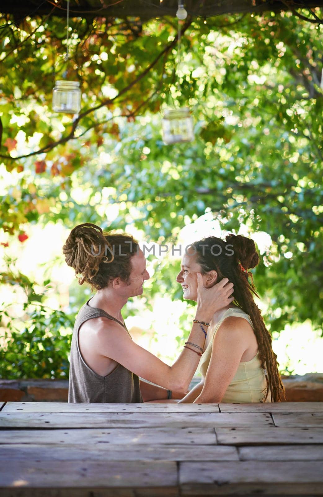 Outdoor, date and sunshine with couple, love and bonding together with romance and happiness. Park, smile or man with woman or cheerful with joy or relationship with marriage or fresh air with nature by YuriArcurs