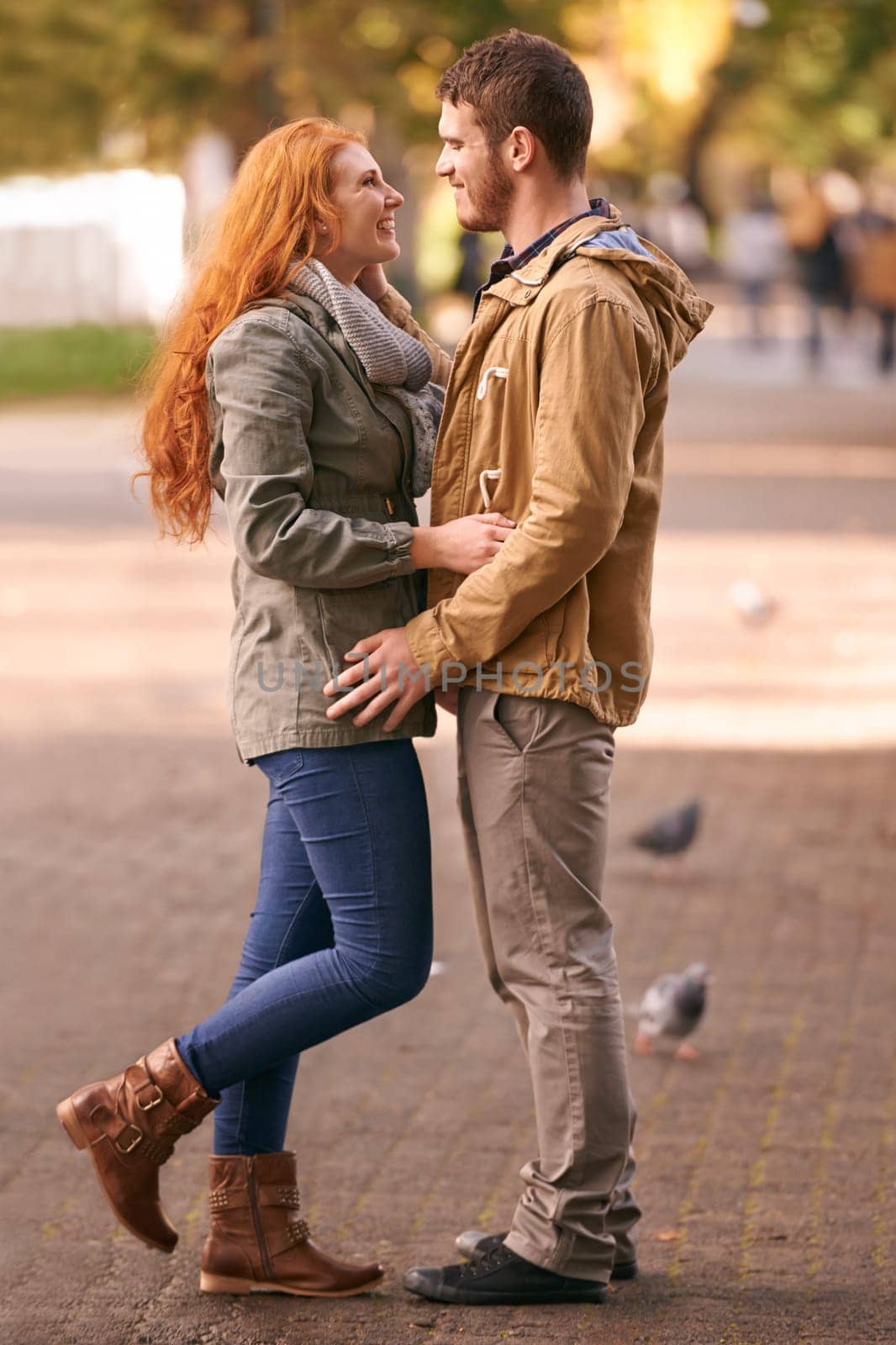Couple, love and smile with date at park in cold weather or winter, together and support in London. Relationship, commitment and bonding for romance with soulmate, care and happiness for affection.
