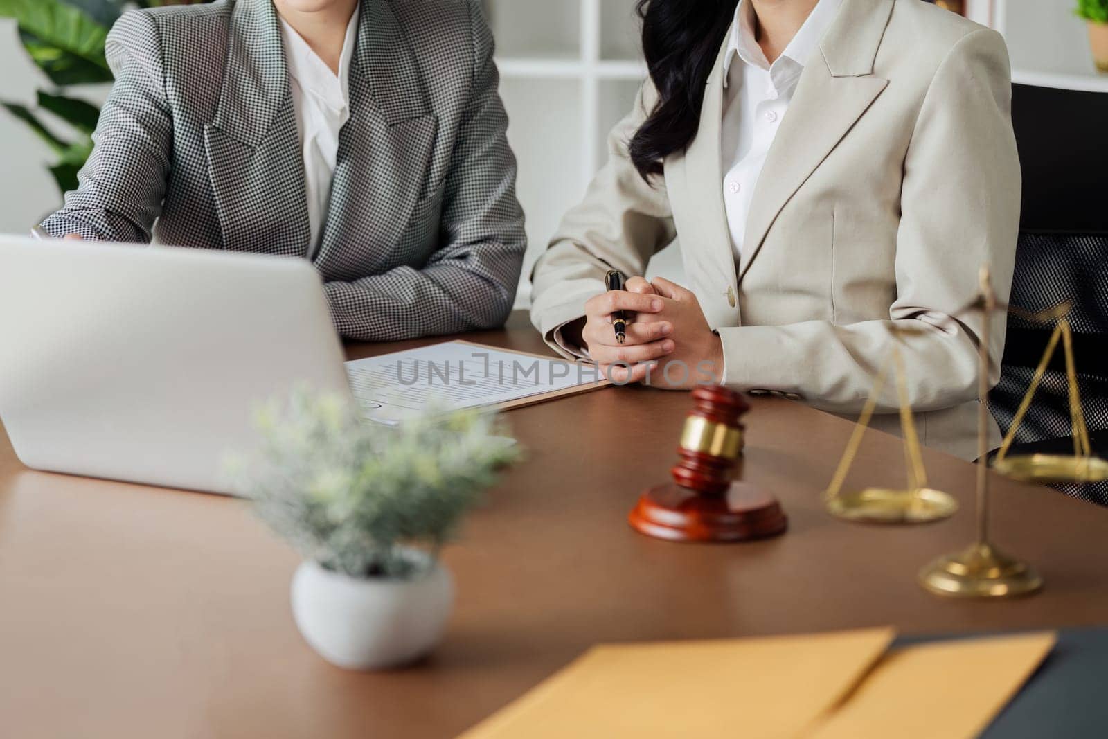 Lawyer working with client discussing contract document in office, consulting to help customer.