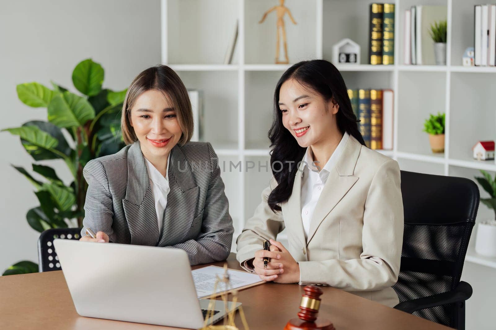 Lawyer working with client discussing contract document in office, consulting to help customer by itchaznong