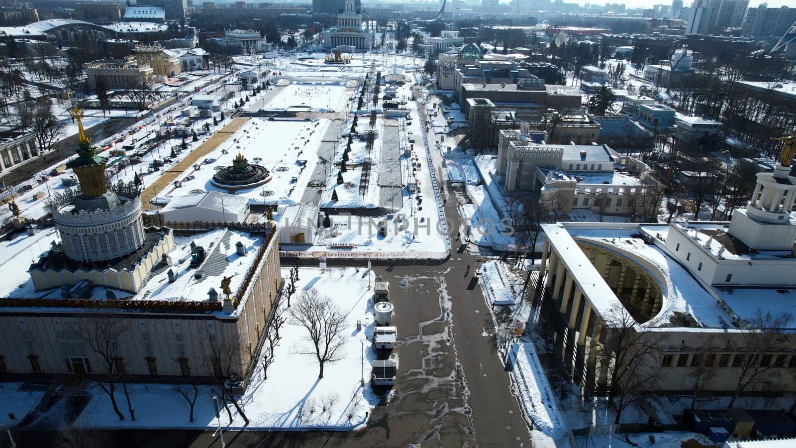 Top view of historic city center with squares and monuments in winter. Creative. Long alley of historical monuments and architecture of city on sunny winter day. Long square with monuments and historical buildings by Mediawhalestock