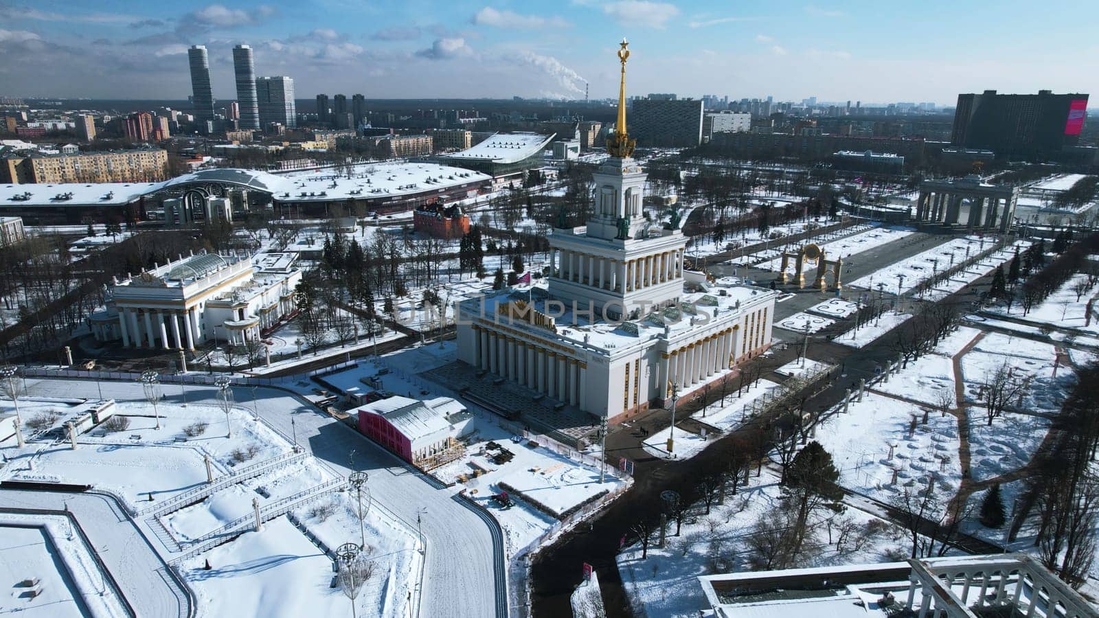 Top view of large square with historical architecture in winter. Creative. Historic square with alleys and Soviet architecture in city center. Winter landscape with Soviet architecture on background of horizon with city by Mediawhalestock