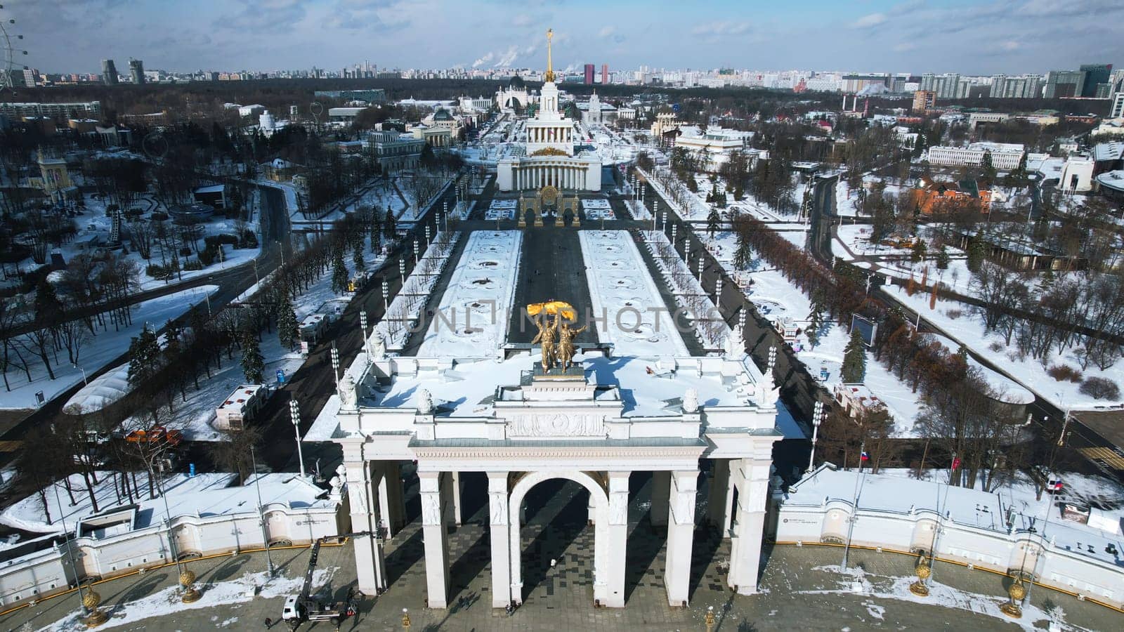 Top view of historic square with arches in winter. Creative. Beautiful historical center with square and steam arches in winter. Soviet architecture in center of big city with square on winter day.