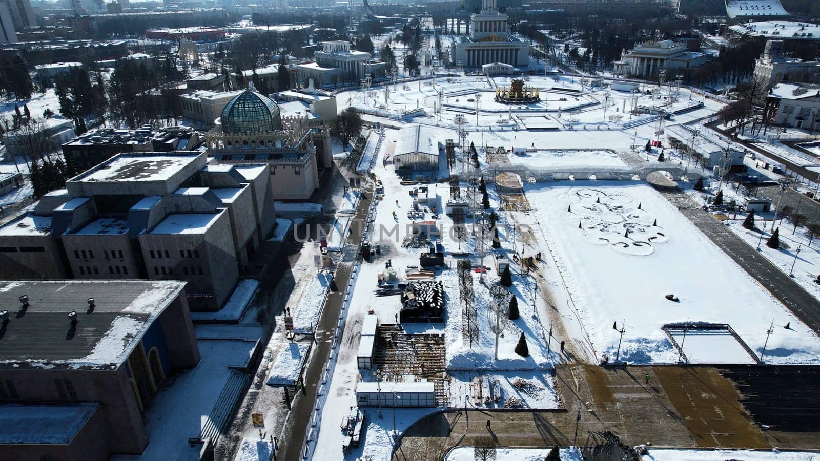Top view of historic city center with squares and monuments in winter. Creative. Long alley of historical monuments and architecture of city on sunny winter day. Long square with monuments and historical buildings.