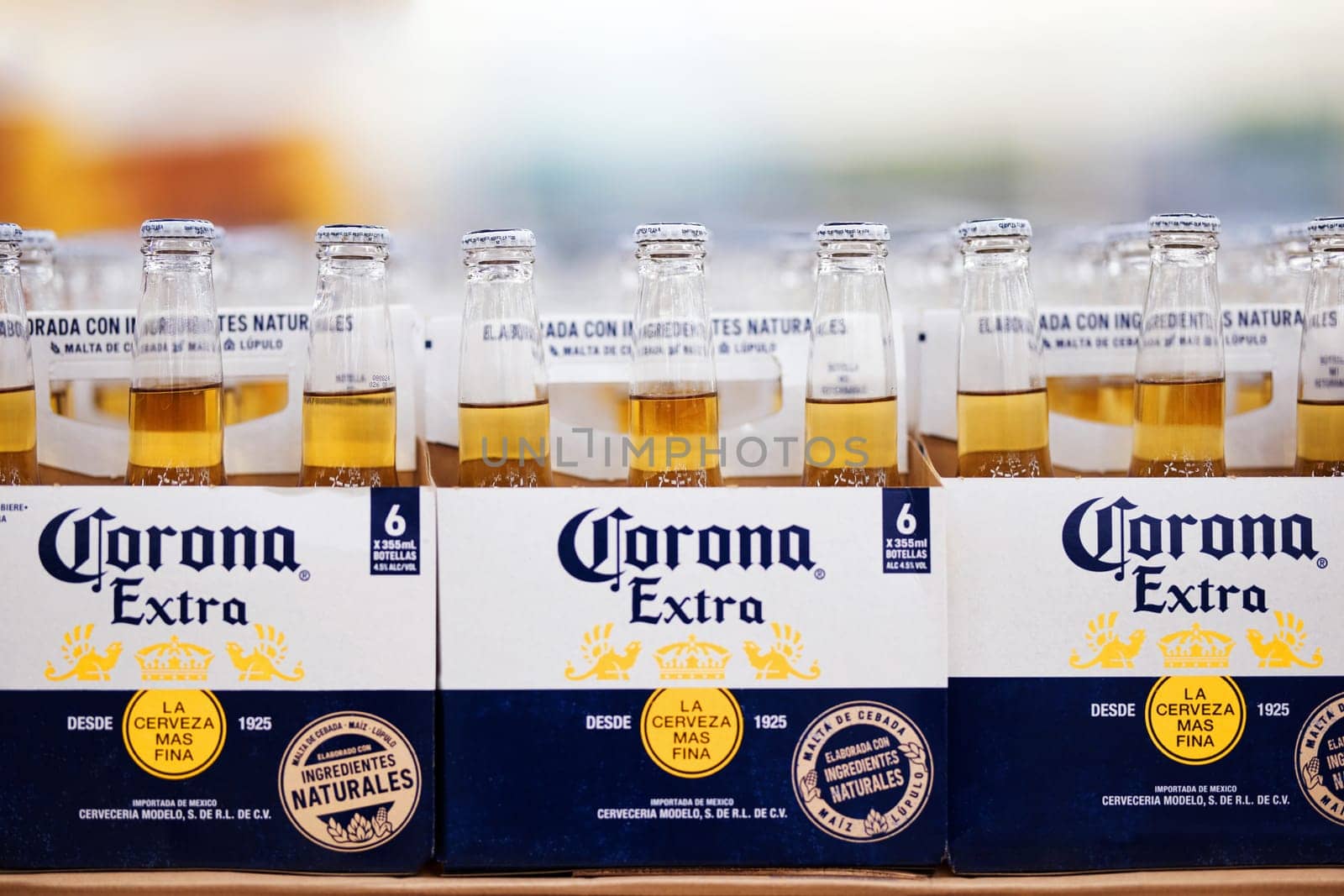 Corona Extra Beer sale, in beer boxes for 6 bottles, with handle. Pile of corona brand mexican beer boxes in a supermarket. Corona is the most popular imported beer in the USA. 20.02.2024, Armenia.