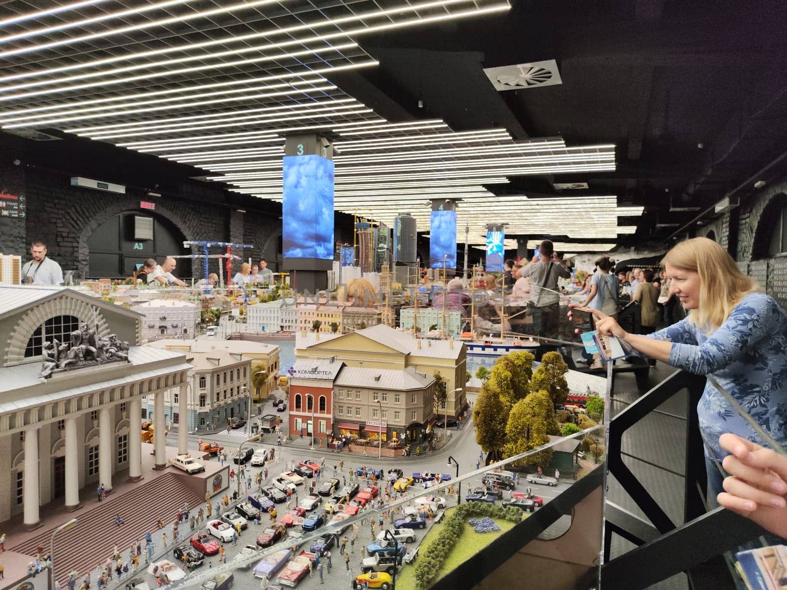 Saint-Petersburg, Russia - August 03, 2023: grand project Russia. Layout of city, country, street, landscape with small toy people, houses, roads, cars, nature and visitors tourists in the museum
