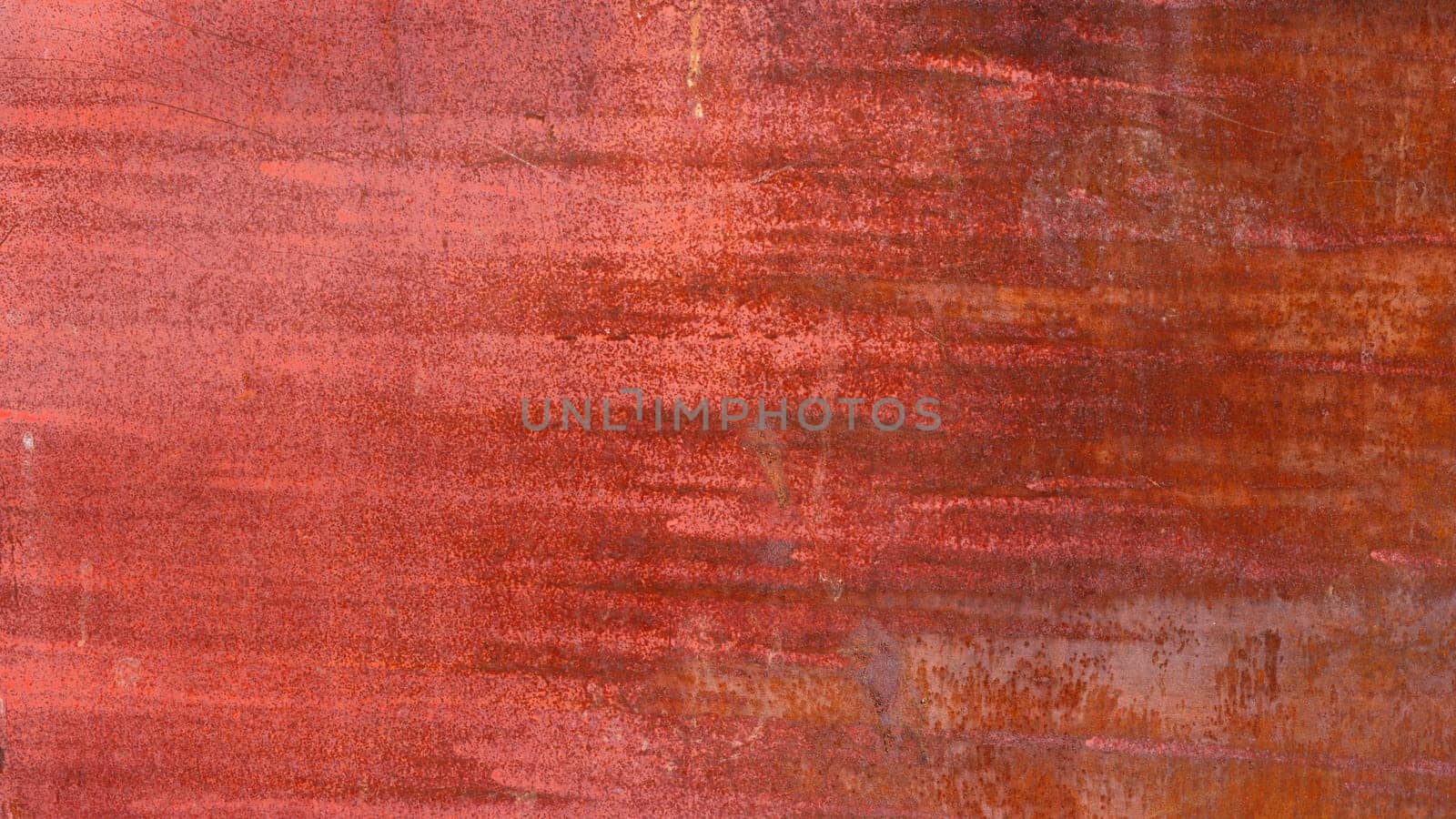rusty red painted flat sheet metal surface full-frame background and texture.