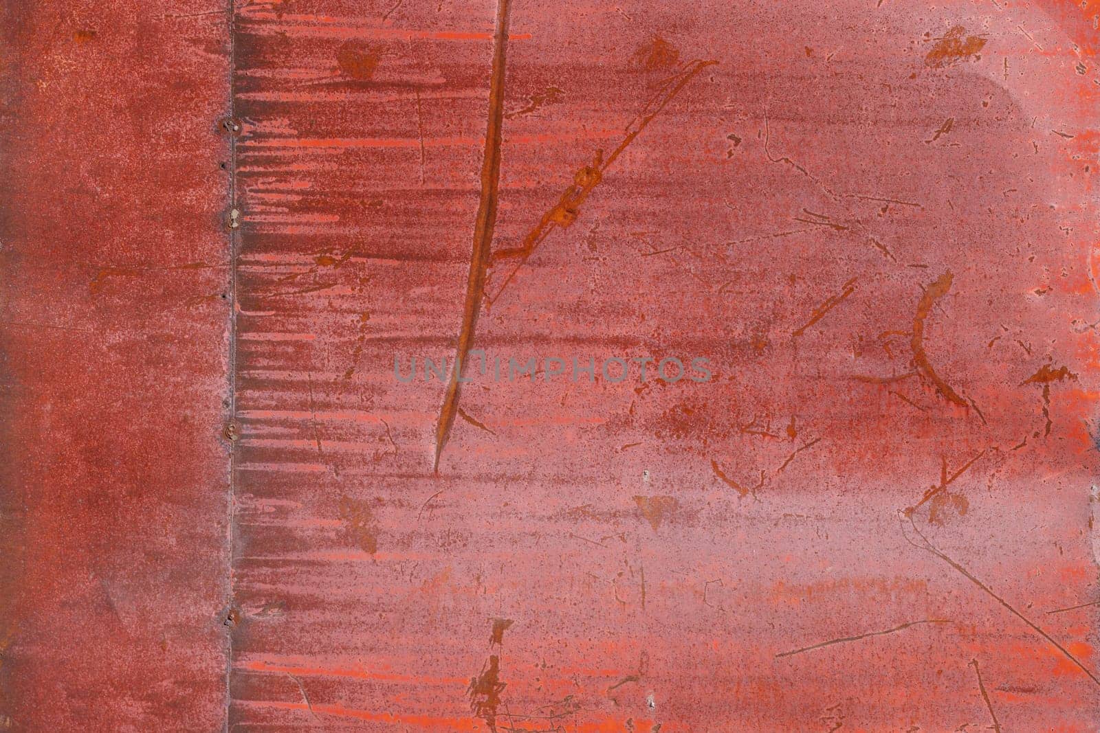 rusty red painted flat sheet metal surface full-frame background and texture.