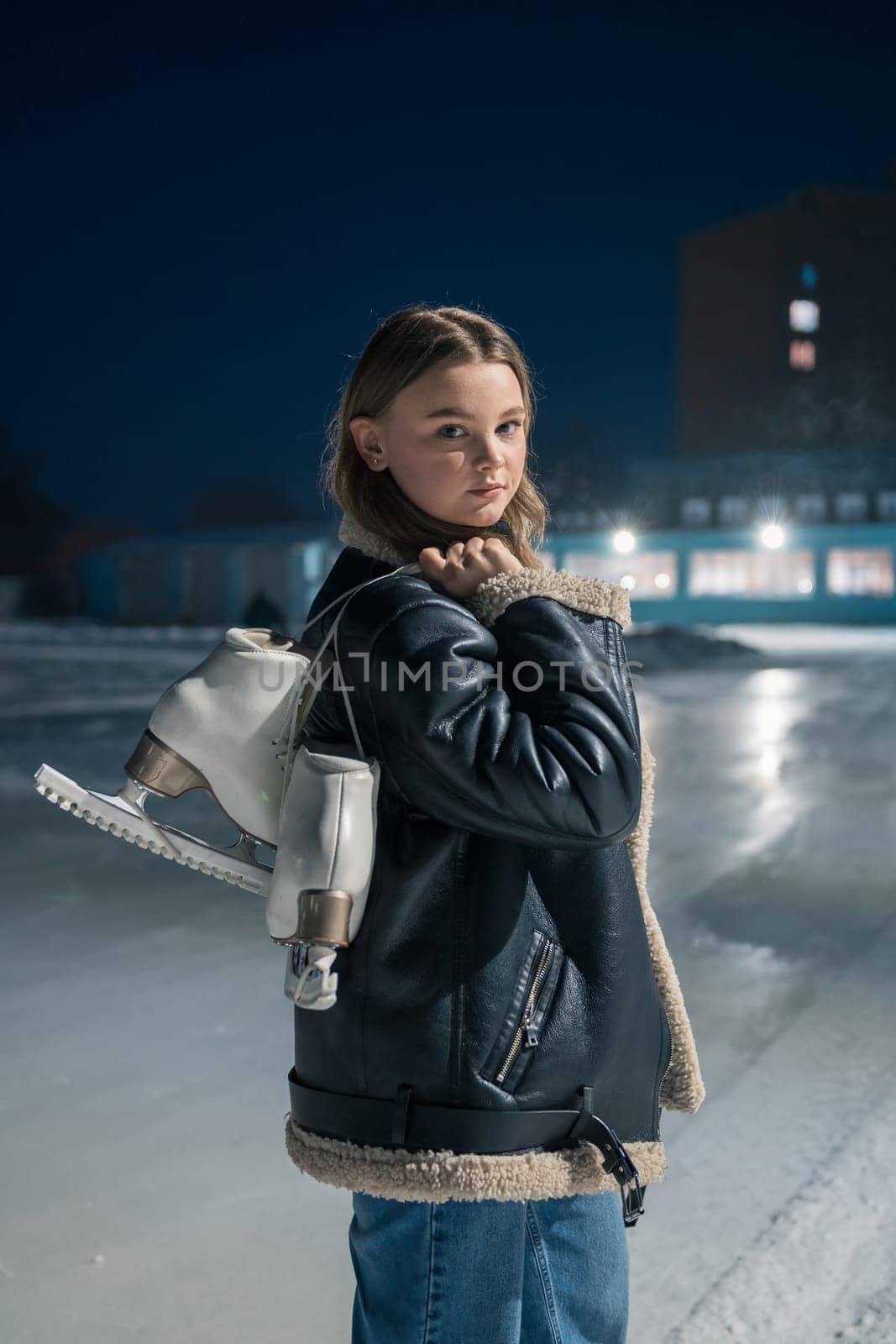 Beautiful young woman is ready for ice skating. Winter activities concept