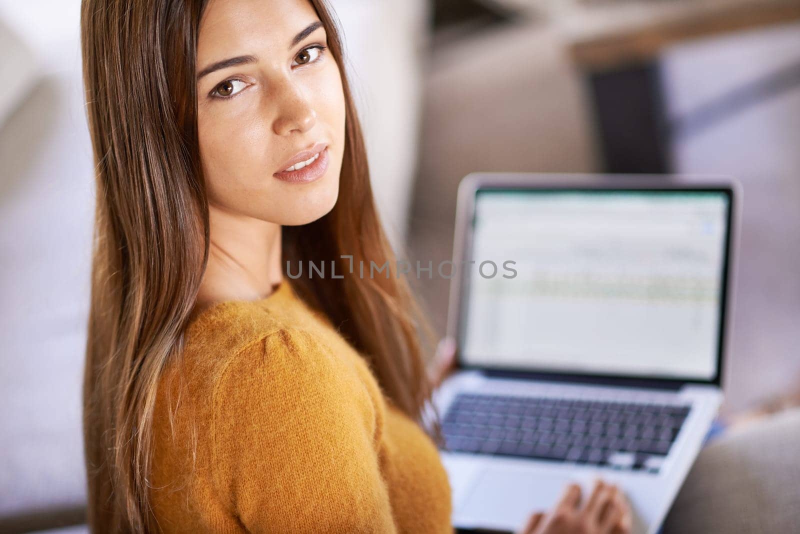 Portrait, home and woman with a laptop, student and relax with connection and online learning in a lounge. Face, apartment and girl on a couch and person with computer and research with technology.